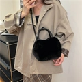 Fashionable black faux fur handbag for women with dual top handles and crossbody strap - Black