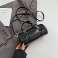 Sleek black bowling bag in glossy patent finish with metallic silver hardware details - Glossy Black