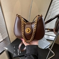 Deep brown vintage leather half-moon bag with gold chain and circular metal clasp - Brown