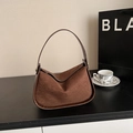 Dark brown faux suede shoulder bag with gold hardware and stylish curved silhouette - Brown