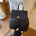 Minimalist black matte leather backpack with gold twist lock for daily commuting - Black