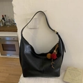 Detail of black leather hobo bag with vintage colorful pompom and wooden bead charm - Black