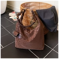 Detail of leopard embossed brown tote with unique wooden bead handle on a stylish background - Leopard Print (With Charm)