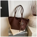 Detail view of coffee suede tote bag with FREE COLOR embossing and leopard star charm - Coffee with Pendant