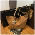 Detailed macro of dark brown suede tote bag featuring FREE COLOR logo and star pendant - Brown with Pendant