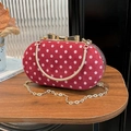 Chic red polka dot clutch bag with golden bow clasp and metallic handle for parties - Red