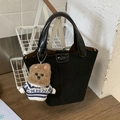 Black suede bucket bag with leather buckle and brown teddy bear charm accessory - Black with Pendant