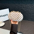 Vintage cream polka dot shoulder bag with gold bow clasp and metal chain strap - White