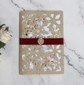 Detail of laser-cut gold glitter snowflake wedding invitation with red silk ribbon - Snowflake Laser Cut (Champagne Gold) / Gold