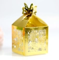 Detail of laser-cut butterfly and floral patterns on golden metallic candy gift box - Reflective Gold