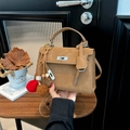 Tan matte leather Kelly style handbag with silver turn-lock and pompom charm accessory - Khaki with Pendant