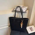 Matte black tote bag with wooden bead charm and long shoulder strap for daily use - Black with Pendant