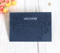 Close-up of laser-cut rose hollow design on navy blue wedding invitation card - Dark Blue