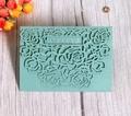 Detail of laser-cut rose floral wedding invitation in mint green with Wedding text - Mint Green
