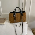 Brown faux suede bucket bag featuring black leather trim and silver metal chain strap - Brown