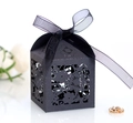 Detail of black laser-cut floral gift box with translucent chiffon ribbon and bow - Black Khaki