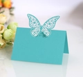 Detail of light blue laser-cut butterfly place cards for wedding table settings - Sky Blue
