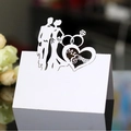 White laser-cut Mr & Mrs wedding table card with hollow heart and couple silhouette - White