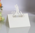 Detailed laser cut white pearl paper wedding place card with Mr & Mrs silhouette - Ivory