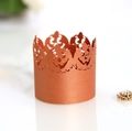 Laser-cut bronze hollow paper cupcake wrapper featuring Halloween jack-o'-lantern details - Antique Bronze