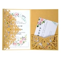 Detail of laser-cut gold lace floral cover with watercolor floral wedding invitations set - Gold