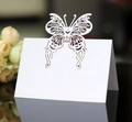 Laser cut white butterfly table card with intricate hollow wing details for weddings - White