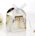 Macro view of laser-cut wedding candy box with champagne finish and ribbon bow - Reflective Silver