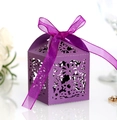 Detail of purple laser-cut flower patterns and organza ribbon bow on a gift box - Dark Purple