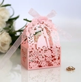 Close-up of pink laser-cut wedding favor box with bride silhouette and silk ribbon - Pink