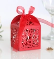 Detail of red laser-cut candy box with floral patterns and matching chiffon ribbon bow - Pearlescent Red
