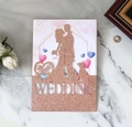 Dettaglio della partecipazione di nozze glitter oro rosa con silhouette sposi tagliata a laser - Oro Champagne Scintillante
