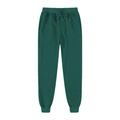 Flat lay of dark green fleece joggers with adjustable drawstring and ribbed cuffs - Green