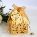 Elegant gold laser-cut wedding favor box with silhouette design and ribbon - Gold
