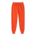 Detail einer hellorangen Jogginghose mit Kordelzug, Gummibund und Rippbündchen - Orange
