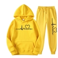 Detail of yellow tracksuit featuring heart print and adjustable drawstring hoodie - Yellow