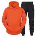 Detail of orange hooded sweatshirt with kangaroo pocket and black drawstring joggers set - Orange and Black Pants