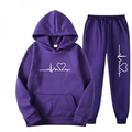 Detail of purple tracksuit featuring white heart-line print on hoodie and sweatpants - Purple