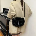 Minimalist black faux fur crossbody bag with leather strap and soft fluffy texture - Black