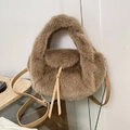 Brown faux fur plush handbag with long strap and tassel detail for autumn winter season - Brown
