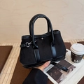 Chic black faux suede bucket bag with smooth leather trim and adjustable shoulder strap - Black