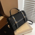 Retro black canvas and leather patchwork handbag with gold buckles and top handle - Black
