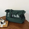 Grand sac cabas en toile vert foncé avec lettrage blanc et une petite pochette assortie - Vert