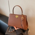 Classic brown matte leather satchel bag featuring gold twist lock and a top handle - Coffee
