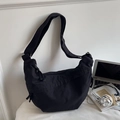 Minimalist black canvas half-moon crossbody bag with adjustable wide shoulder strap - Black