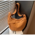 Brown canvas hobo crossbody bag featuring a minimalist half-moon shape and wide strap - Brown