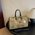 Khaki graffiti canvas travel bag with cartoon prints, black handles and shoulder strap - Khaki
