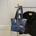 Quilted down tote bag in metallic deep blue with double handles for versatile shoulder carry - Blue