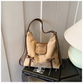 Detail of beige suede bag featuring leopard print bows and brown leather flap accent - Khaki