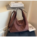 Detail of dark brown suede Hobo bag showing soft matte texture and seamless zipper closure - Coffee