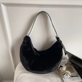 Chic black faux fur hobo shoulder bag with leather strap and modern minimalist design - Black